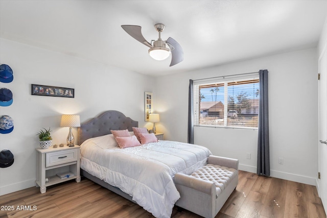 bedroom with ceiling fan and wood-type flooring