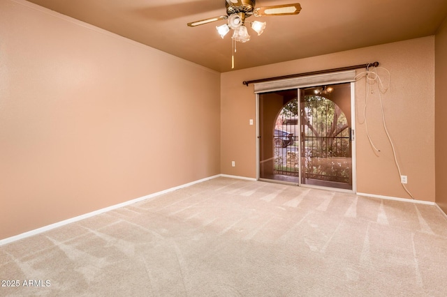 empty room featuring ceiling fan and carpet flooring