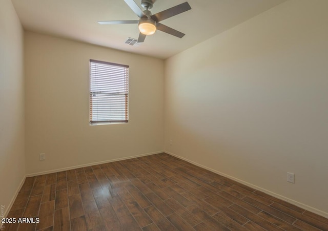 unfurnished room featuring dark hardwood / wood-style floors and ceiling fan