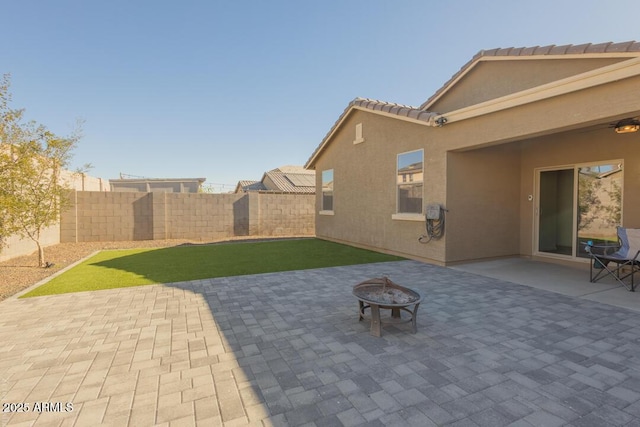 view of patio featuring a fire pit