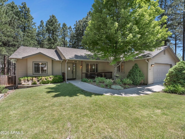 490 E Twelve Oaks Dr, Flagstaff, AZ 86005 - single story home featuring an attached garage, a porch, driveway, and a shingled roof