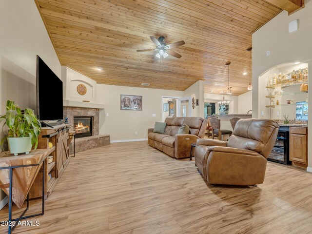 490 E Twelve Oaks Dr, Flagstaff, AZ 86005 - living area featuring wooden ceiling, beverage cooler, high vaulted ceiling, a glass covered fireplace, and light wood-style floors