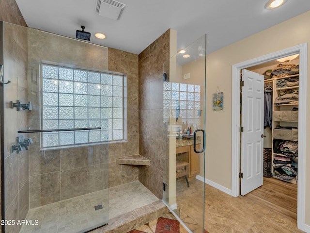 490 E Twelve Oaks Dr, Flagstaff, AZ 86005 - bathroom featuring a shower stall and a walk in closet