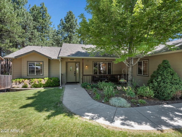 490 E Twelve Oaks Dr, Flagstaff, AZ 86005 - ranch-style home with a front yard, covered porch, and roof with shingles
