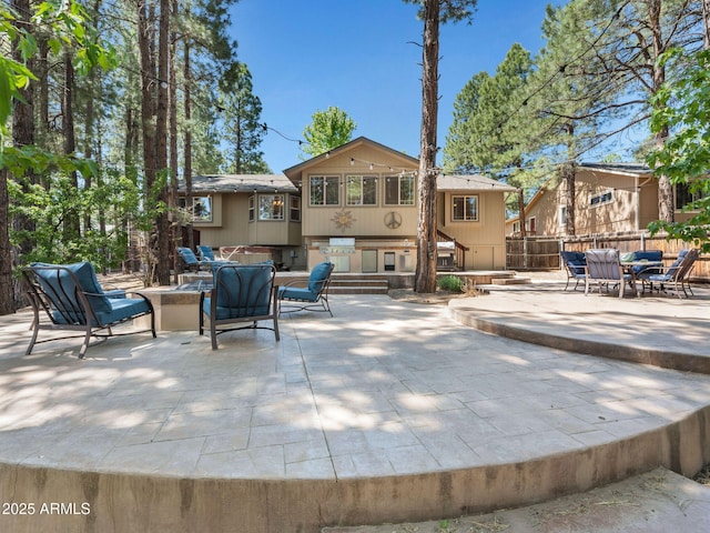 490 E Twelve Oaks Dr, Flagstaff, AZ 86005 - view of patio featuring an outdoor fire pit