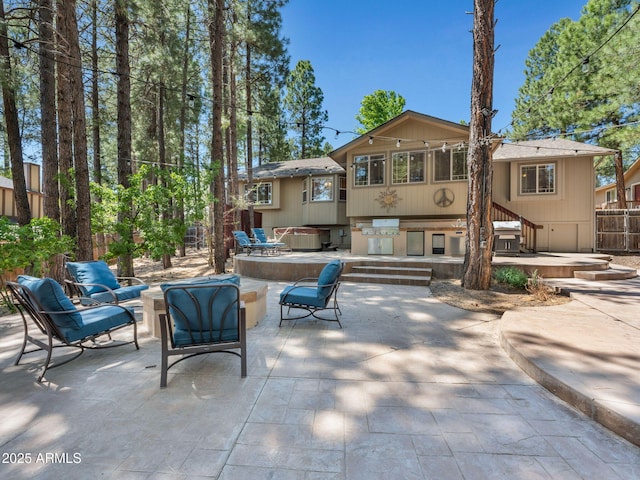 490 E Twelve Oaks Dr, Flagstaff, AZ 86005 - view of patio / terrace featuring a jacuzzi and grilling area