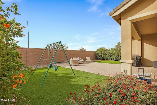 exterior space featuring a patio, an outdoor hangout area, and a lawn