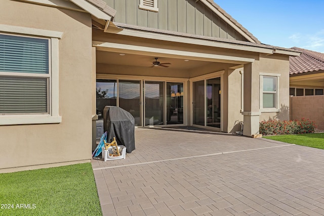 view of patio with grilling area and ceiling fan