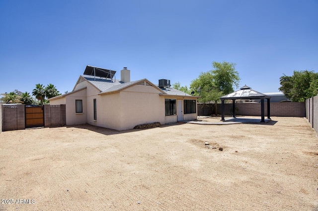 722 W Topeka Dr, Phoenix, AZ 85027 - back of property with a gazebo, a patio, a fenced backyard, a chimney, and central AC