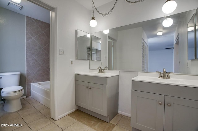 722 W Topeka Dr, Phoenix, AZ 85027 - bathroom featuring two vanities, tile patterned floors, toilet, and baseboards