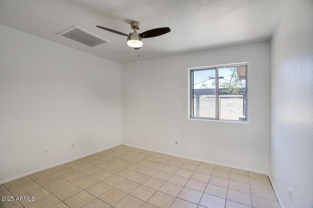 722 W Topeka Dr, Phoenix, AZ 85027 - spare room featuring a ceiling fan, baseboards, and light tile patterned floors