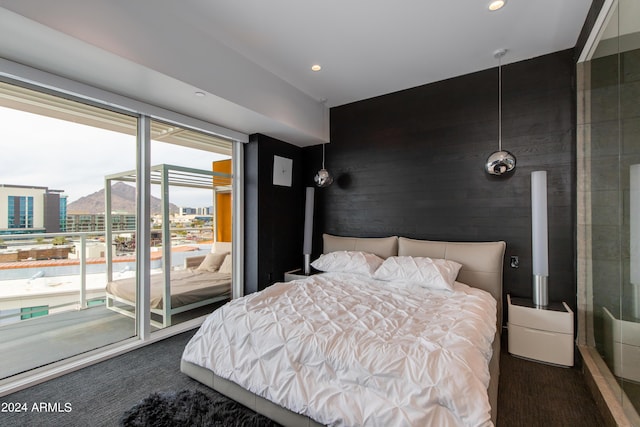 carpeted bedroom featuring access to exterior and recessed lighting