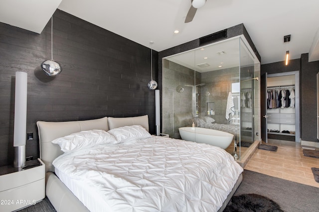 bedroom with tile patterned flooring, tile walls, a ceiling fan, and recessed lighting