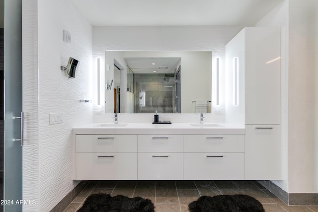 full bath with a shower stall and double vanity
