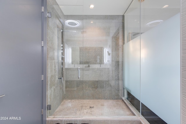 full bath with a shower stall