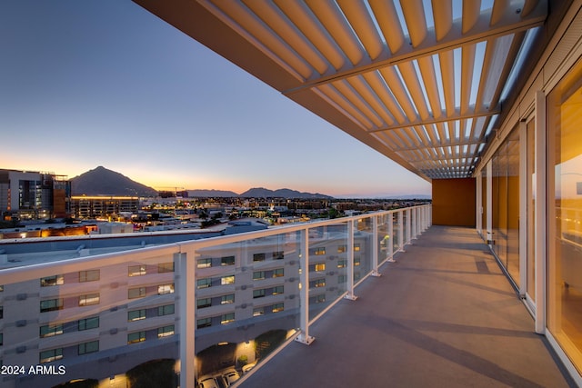 balcony at dusk with a city view