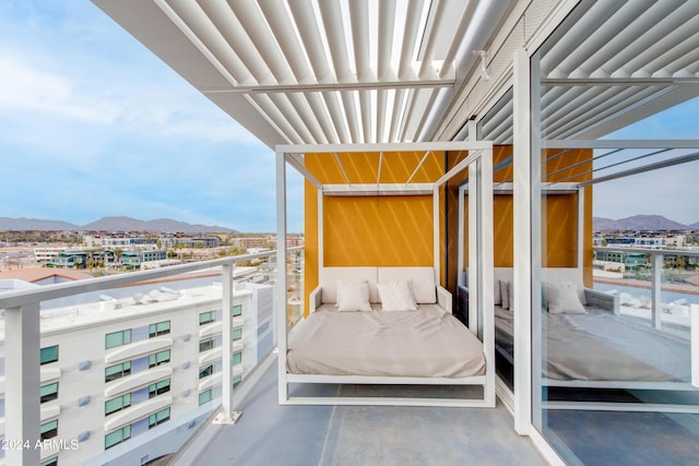 balcony featuring a mountain view
