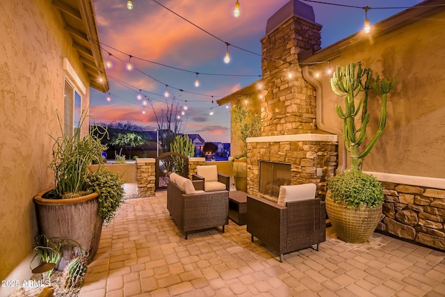31517 N 41st St, Cave Creek, AZ 85331 - patio terrace at dusk with an outdoor living space with a fireplace