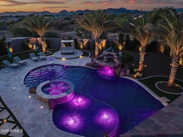 31517 N 41st St, Cave Creek, AZ 85331 - view of swimming pool with a patio, a pool with connected hot tub, a mountain view, and a fenced backyard