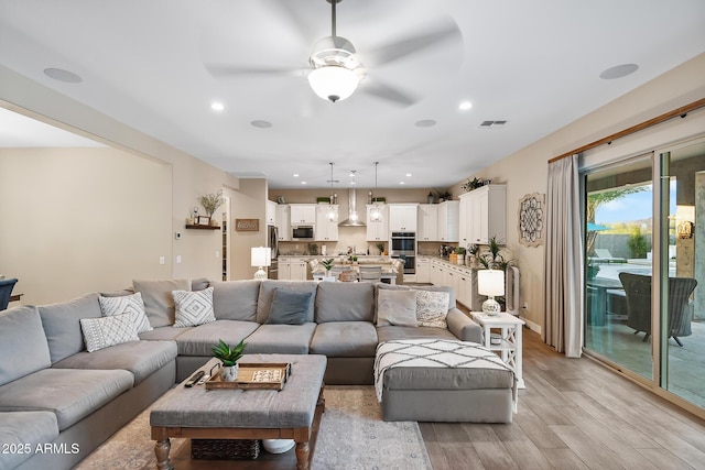31517 N 41st St, Cave Creek, AZ 85331 - living room with light wood-style floors, ceiling fan, and recessed lighting