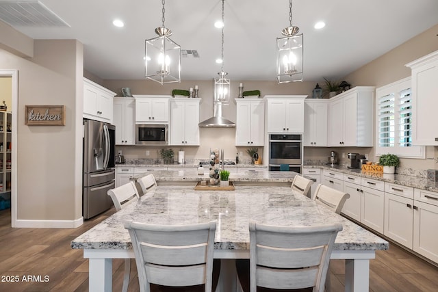 31517 N 41st St, Cave Creek, AZ 85331 - kitchen featuring appliances with stainless steel finishes, a center island, white cabinets, dark wood-type flooring, and recessed lighting