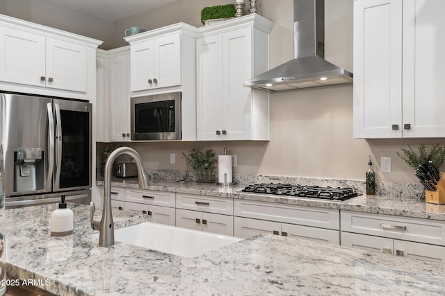 31517 N 41st St, Cave Creek, AZ 85331 - kitchen with stainless steel appliances, wall chimney exhaust hood, white cabinetry, and a sink