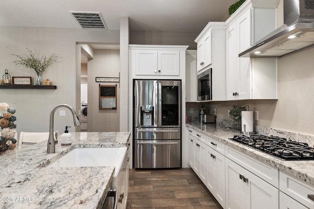 31517 N 41st St, Cave Creek, AZ 85331 - kitchen featuring appliances with stainless steel finishes, wall chimney range hood, dark wood-style floors, and white cabinets