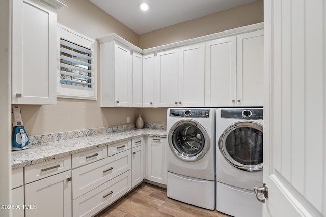 31517 N 41st St, Cave Creek, AZ 85331 - clothes washing area with cabinet space, washing machine and dryer, light wood-style flooring, and recessed lighting