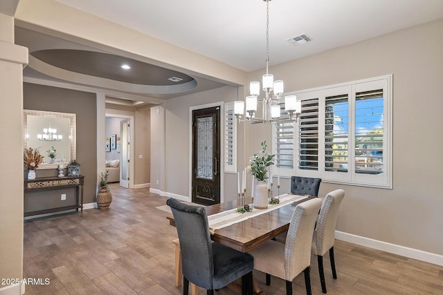 31517 N 41st St, Cave Creek, AZ 85331 - dining area featuring a chandelier, baseboards, and wood finished floors