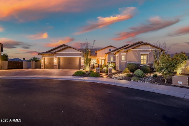 31517 N 41st St, Cave Creek, AZ 85331 - view of front of home with driveway, stone siding, a garage, fence, and a gate