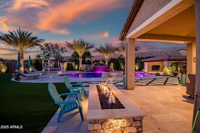 31517 N 41st St, Cave Creek, AZ 85331 - patio terrace at dusk featuring a fire pit and a pool with connected hot tub