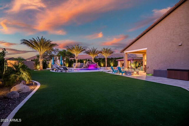31517 N 41st St, Cave Creek, AZ 85331 - yard at dusk with a fire pit, a patio, and a jacuzzi