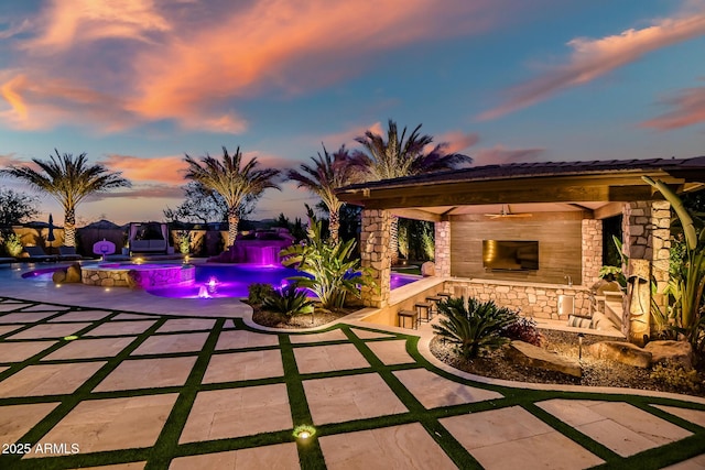31517 N 41st St, Cave Creek, AZ 85331 - patio terrace at dusk featuring an outdoor bar, a gazebo, an outdoor pool, and a fenced backyard