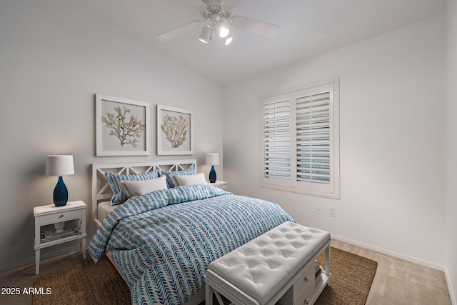 bedroom with vaulted ceiling, carpet flooring, and ceiling fan