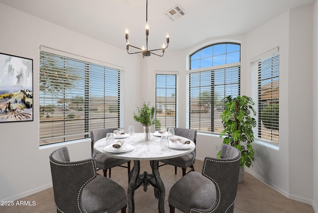 dining area featuring a notable chandelier