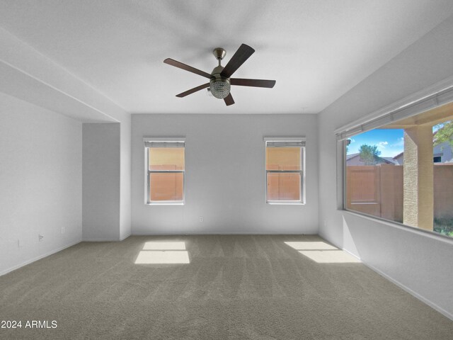 spare room with ceiling fan and carpet flooring