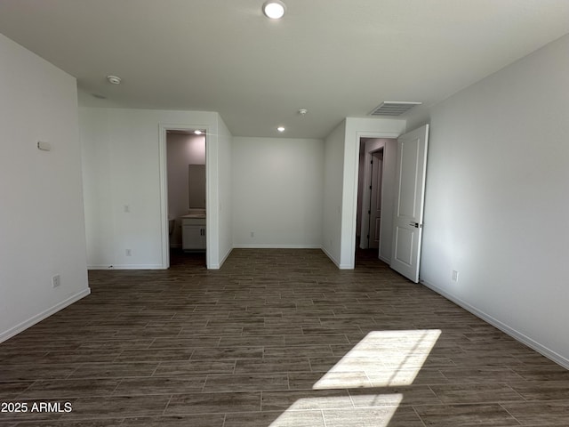 unfurnished room featuring dark hardwood / wood-style flooring