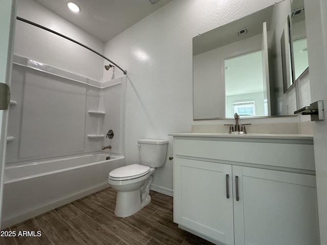 full bathroom with shower / tub combination, vanity, and toilet