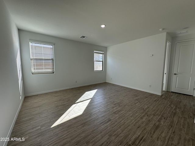 unfurnished room featuring dark hardwood / wood-style floors