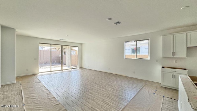 interior space featuring plenty of natural light and light hardwood / wood-style floors