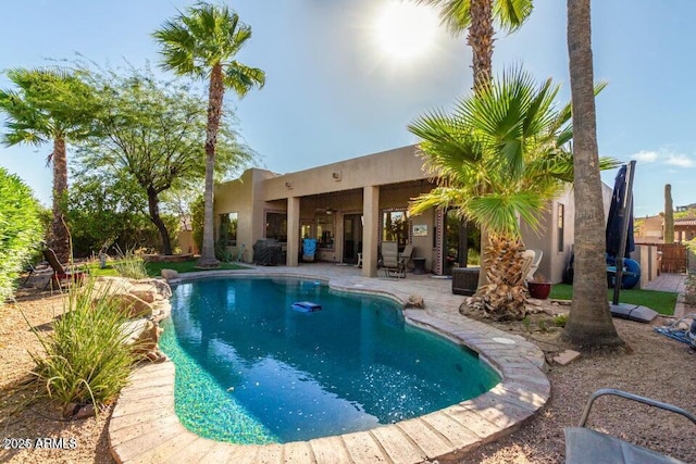 view of swimming pool featuring a patio area