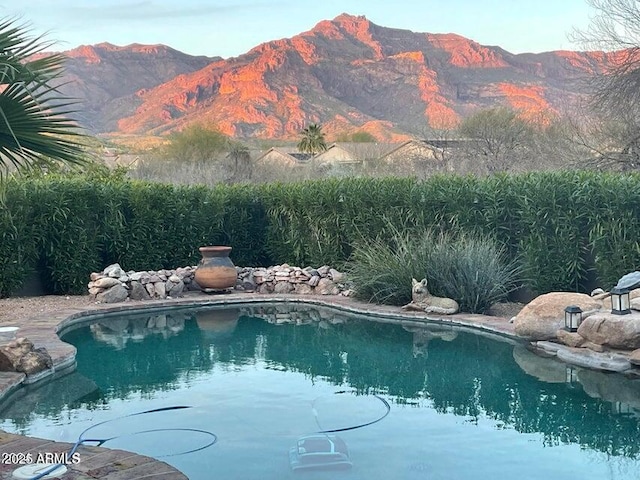 view of pool with a mountain view