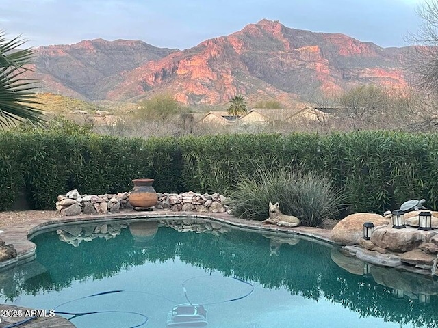 view of swimming pool featuring a mountain view