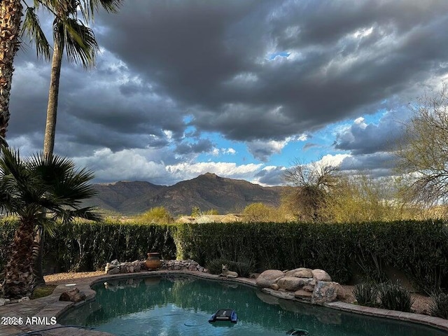 view of pool with a mountain view