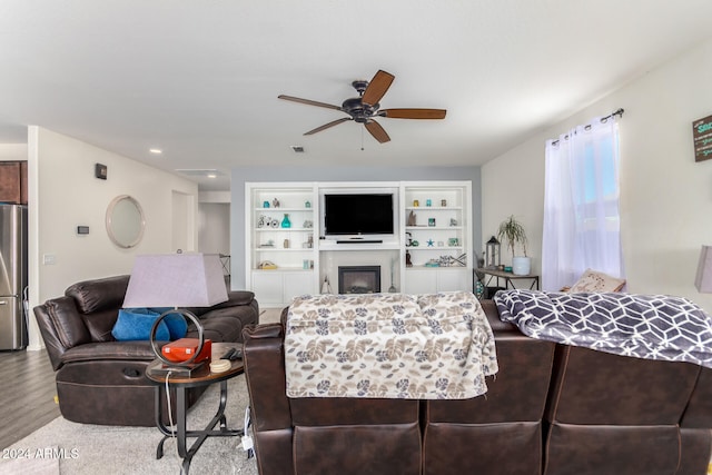 living room with ceiling fan and hardwood / wood-style floors