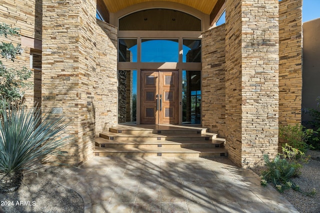 view of exterior entry featuring french doors