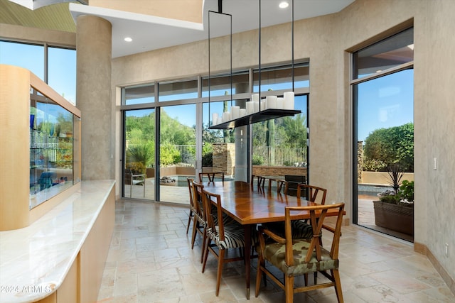 dining space with light tile flooring