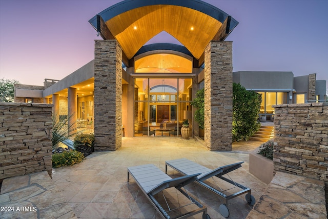 view of patio terrace at dusk