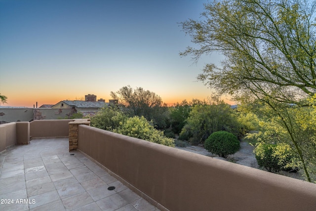 view of balcony at dusk