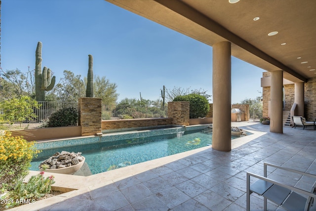 view of swimming pool with a patio area